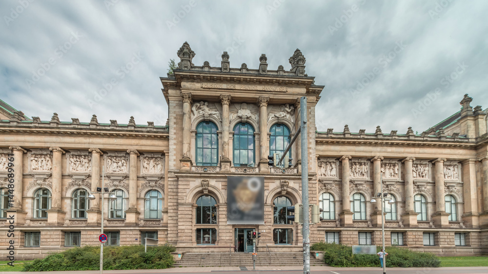 Fototapeta premium Hyperlapse of Hanover's Lower Saxony State Museum with passing traffic and people in front of its historic facade. Germany
