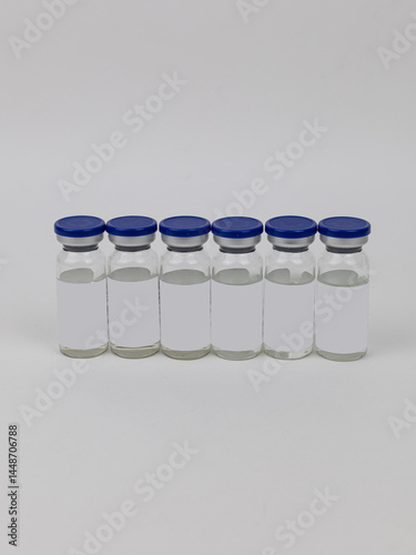 A set of empty glass medicine bottles. Sample bottles with space for writing on the label.