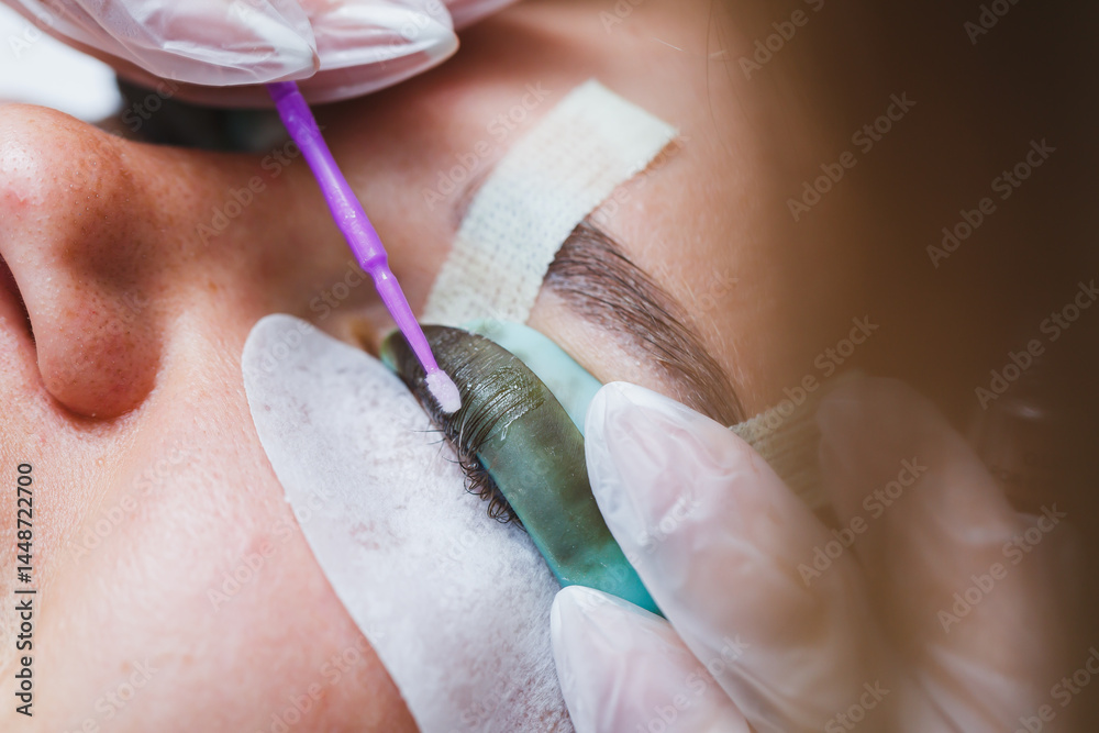 Eyelash lamination close-up on a woman's face. Women's beauty procedures.
