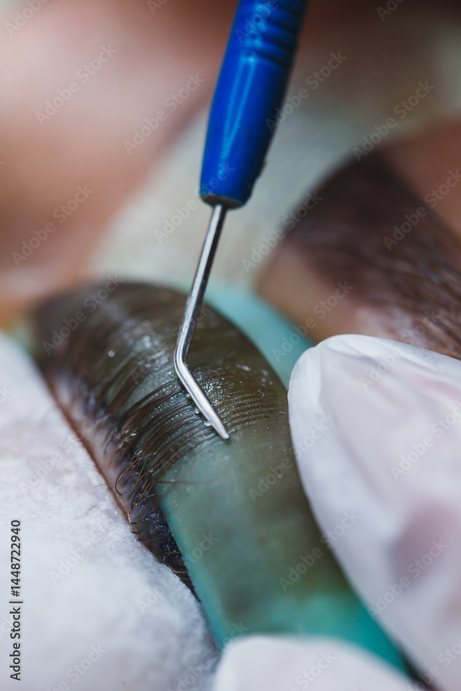 Eyelash lamination close-up on a woman's face. Women's beauty procedures.