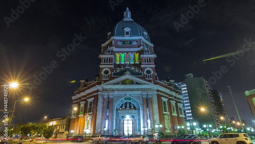 Exterior of the Immaculate Heart of Mary Church illuminated at night timelapse hyperlapse. Lima, Peru