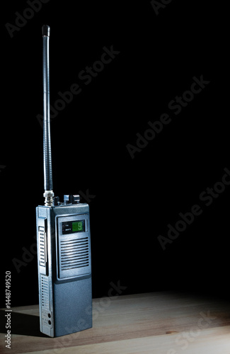 Obraz na płótnie Walkie-talkie on a table set to channel nine with a black background w salonie