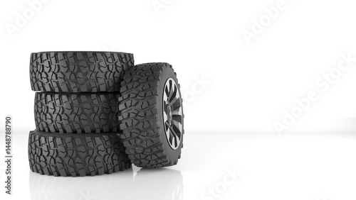 car wheels are lying on the podium car tires. Car tires near gray wall
