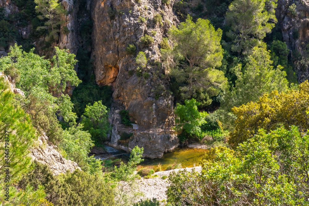 Canaletes river flowing at fontcalda sanctuary in gandesa, tarragona, spain