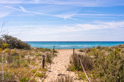 Obraz na płótnie Sandy path leading to the roc de sant gaieta in tarragona, spain w salonie