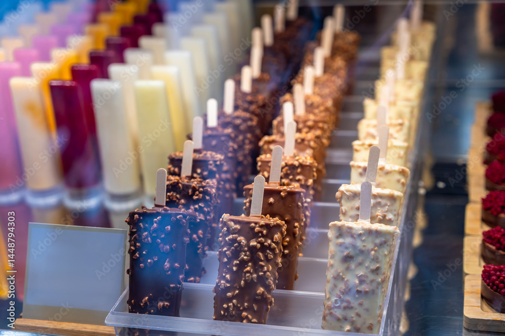 Ice cream popsicles displayed in ice cream shop window