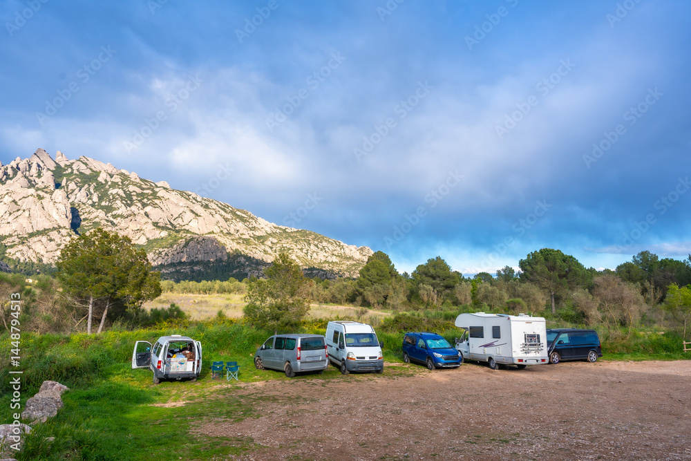 Camper vans parked near montserrat massif in catalonia, spain