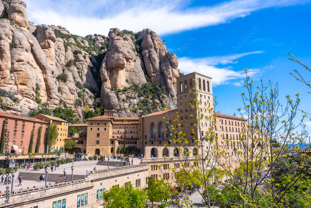 Tourists visiting the santa maria de montserrat abbey in the montserrat massif