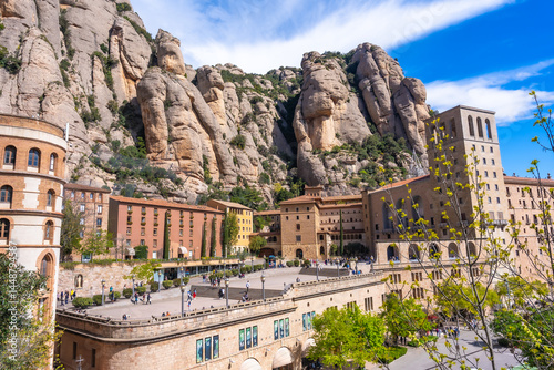 Obraz na płótnie Tourists visiting the santa maria de montserrat abbey in the montserrat massif, catalonia w salonie
