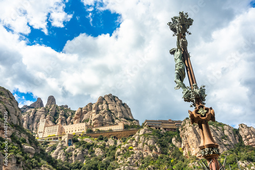 Obraz na płótnie Montserrat monastery and crucifix statue under cloudy sky w salonie