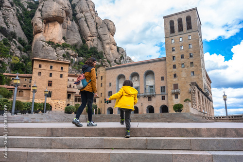Tourists walking up stairs at santa maria de montserrat abbey