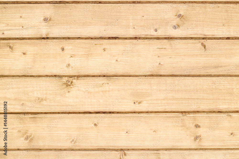 Fototapeta premium Wooden boards arranged in a natural pattern create a rustic and warm atmosphere for home decor