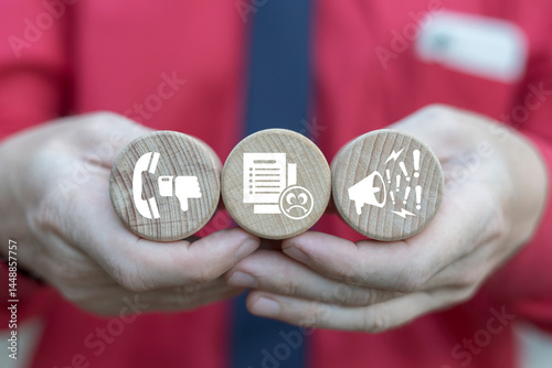 Obraz na płótnie Business person holding wooden blocks with icons symbolizing concept: COMPLAINTS. Client complaints, bad rating review, experience negative, low quality service, unhappy customers. Complaint concept. w salonie
