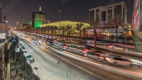 Aerial day to night timelapse of King Fahd Road near the illuminated Riyadh National Library in Riyadh, Saudi Arabia.