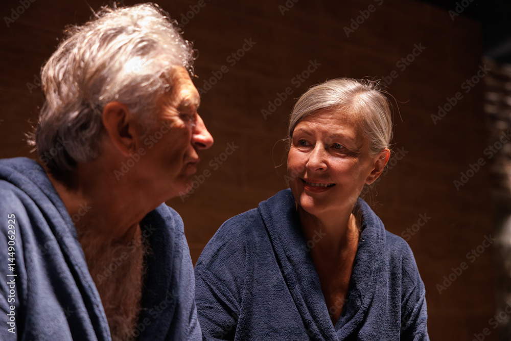 Smiling woman looking at her serious husband in modern spa club Smiling woman looking at her serious husband in modern spa club