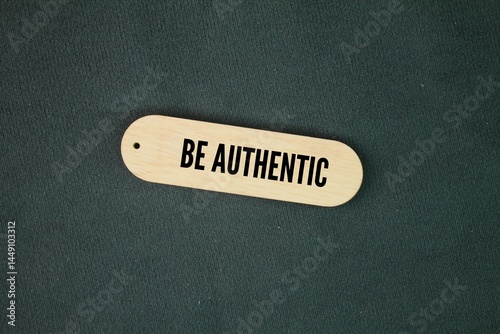 wooden tag with the word BE AUTHENTIC. not fake or copied, genuine or real