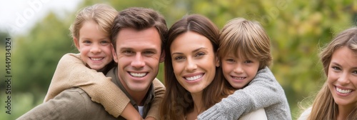 Happy family with children piggyback outdoors, perfect for a family portrait or a joyful moment