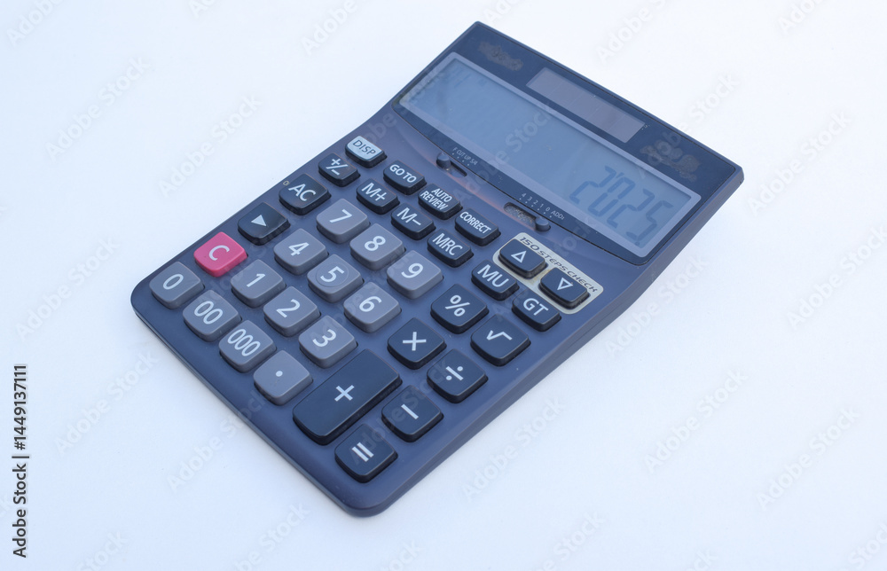 Calculator with 2025 numbers on the screen. Concept of finance, taxes, savings and economic crisis. Isolated on white background Calculator with 2025 numbers on the screen. Concept of finance, taxes, savings and economic crisis. Isolated on white background
