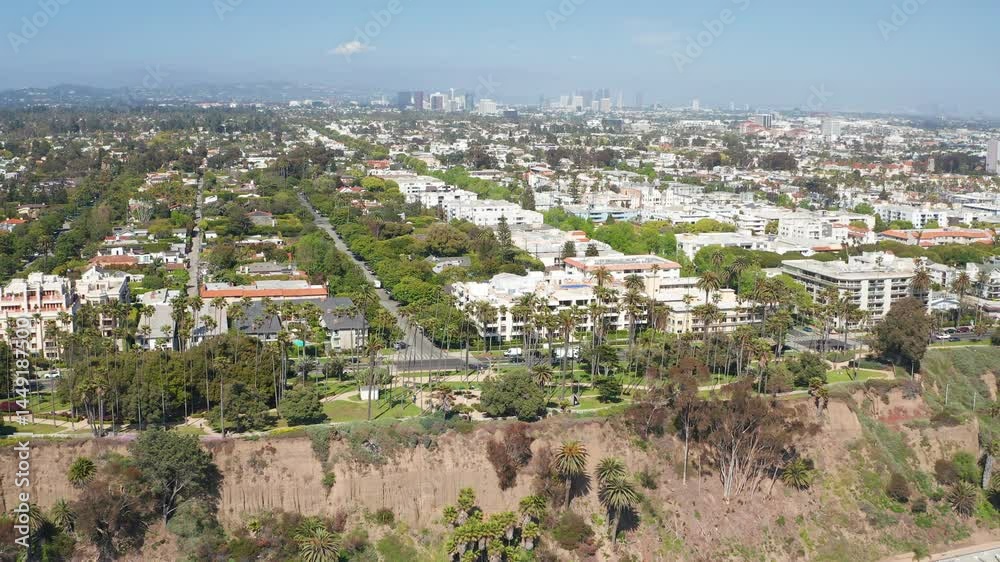 Aerial cinematic pullback view of Santa Monica Los Angeles homes tree skyline Aerial cinematic pullback view of Santa Monica Los Angeles homes tree skyline