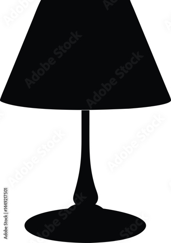 Sleek black table lamp silhouette is casting a soft light in the room
