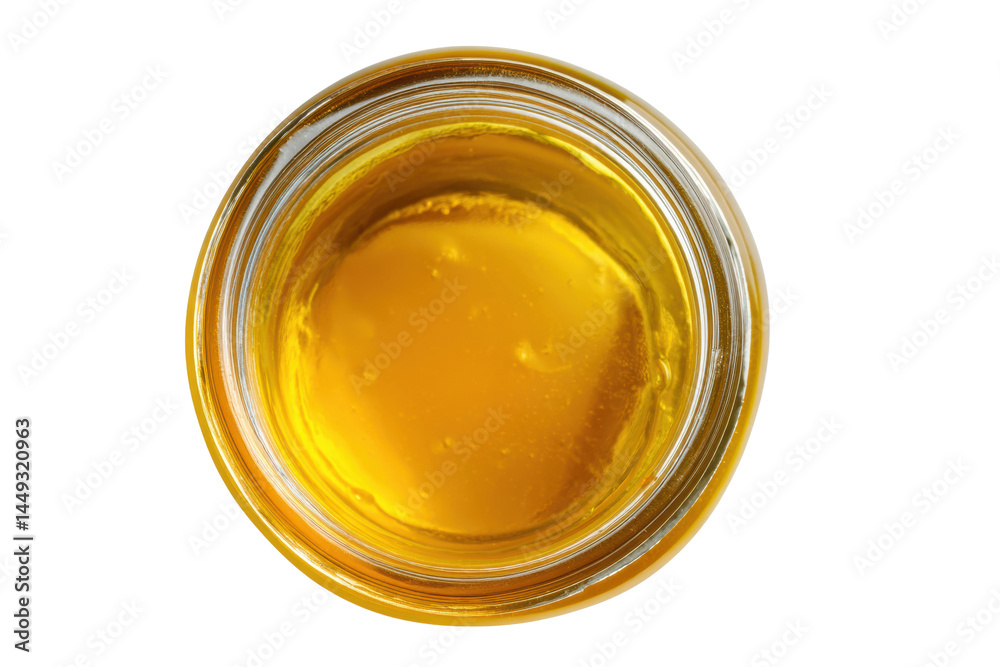 Top view of clear glass jar filled with golden honey against white background, cut out Top view of clear glass jar filled with golden honey against white background, cut out