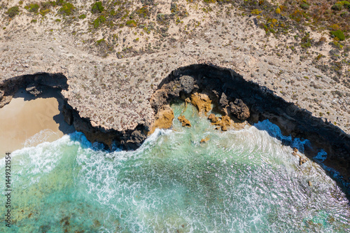 Eroded clifs along a rugged coastline photo