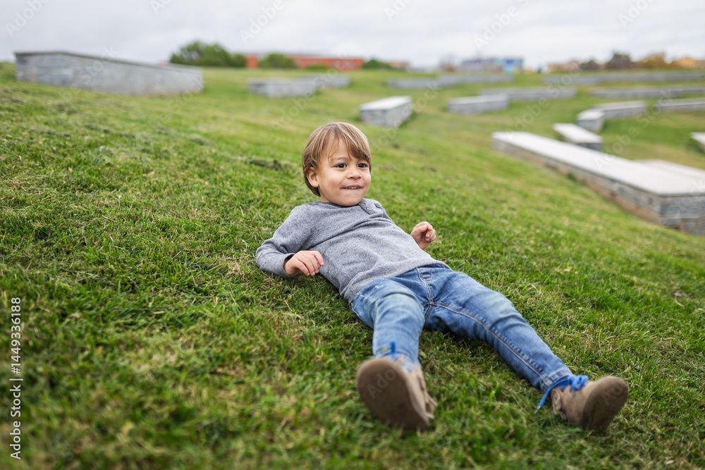 Portrait of a blond boy in nature on a cloudy autumn day Portrait of a blond boy in nature on a cloudy autumn day