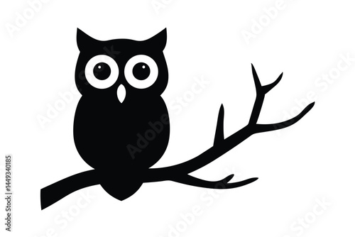 Silhouette of an owl perched on a tree branch