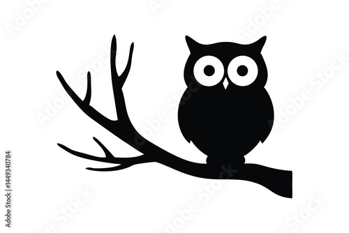 Silhouette of an owl perched on a tree branch