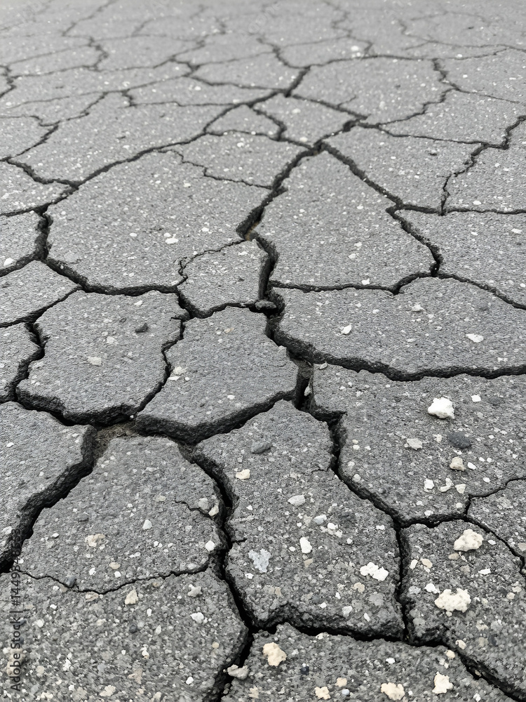 Obraz premium Old cracked grungy asphalt road background
