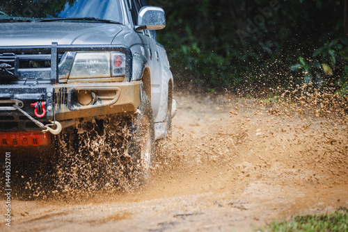Off-road vehicles driving on muddy tracks. Mud and water splash in off-road racing. Offroad car expedition
