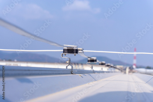 Bild auf Leinwand Close up Lightning Protection Components,lightning protection system to prevent lightning damaging the building is install on metal sheet rooftop building