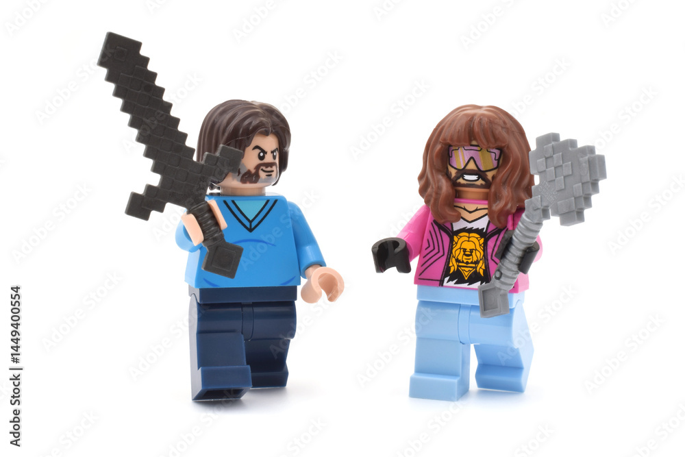 Naklejka premium Lego minifigures of Garrett and Steve main character from video game Minecraft movie are going with weapons or swords. Editorial illustrative image of popular plastic toys.