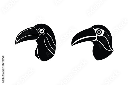Two distinctive black toucan head silhouettes showcasing detailed eye and beak profiles for design and illustration