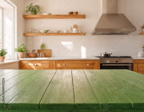 Empty wooden table with the bright white interior of the kitchen as a blurred background behind the bokeh golden sunshin