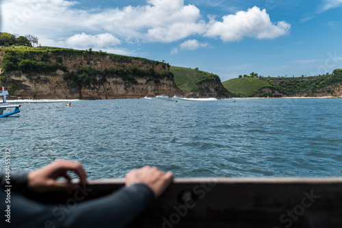 Surfer POV watch friends catching waves, Indonesia photo