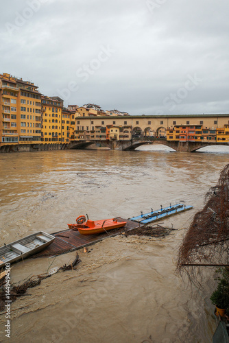 Boats scattered around by current during a flood in Firenze photo