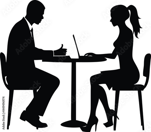 African businessman approves deal as Caucasian businesswoman types at table with laptop