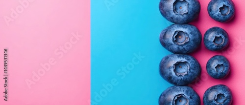 Obraz na płótnie Blueberries on a vibrant pink and blue background creating a visually appealing and healthy food composition w salonie