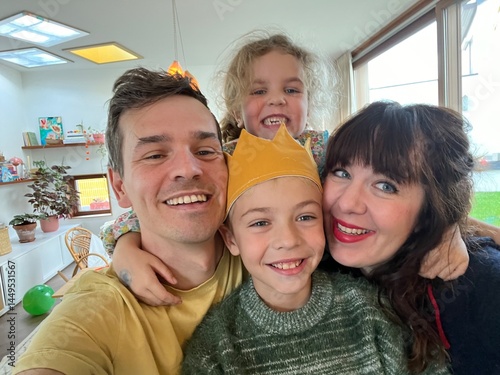 whimsical family photo with playful expressions and fun