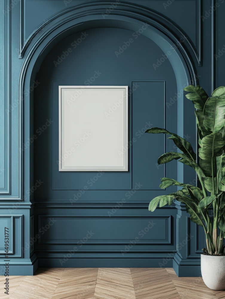 Elegant interior with blue wall and plant featuring a blank frame for art display