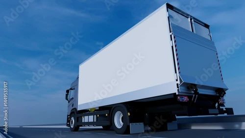 The truck is driving on the highway