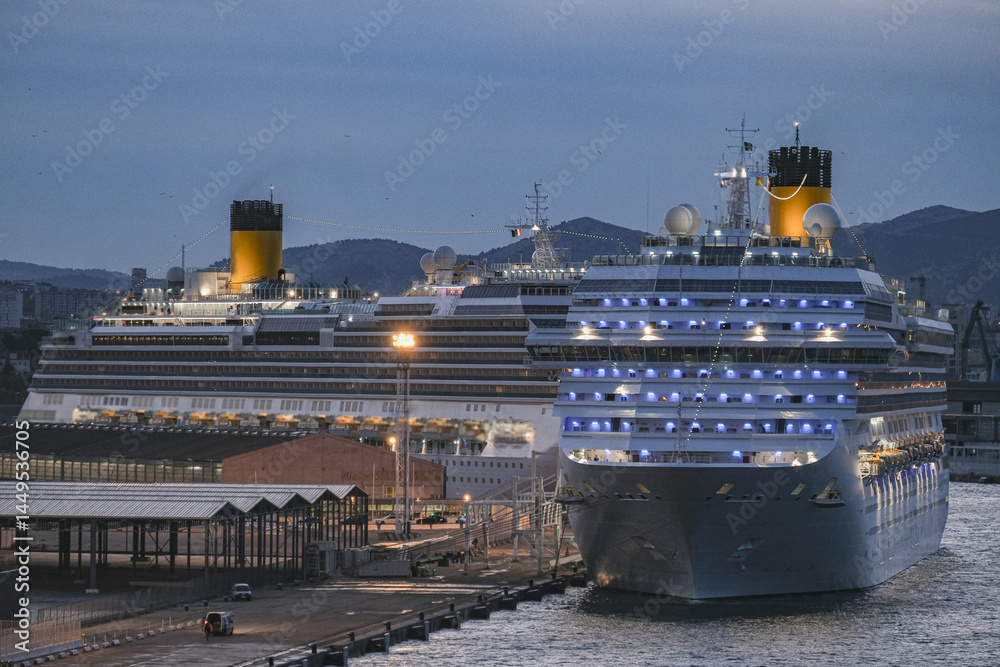 Mega family cruiseship cruise ship liner Fortuna docked at terminal in Marseille Provence, France during breathtaking sunset sunrise twilight blue hour dusk dawn silhouette scenic panorama
