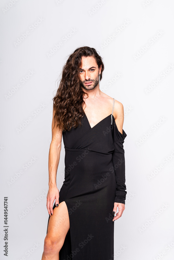 Non-binary Individual in Elegant Black Dress Posing in Studio Setting During Daytime Non-binary Individual in Elegant Black Dress Posing in Studio Setting During Daytime