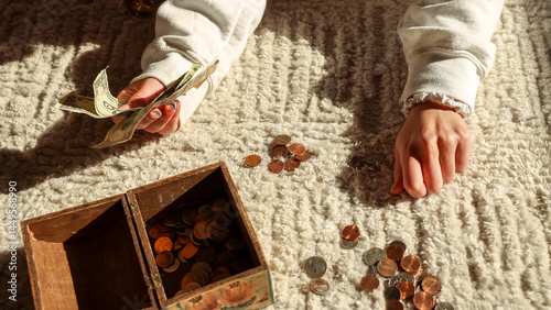 Teen Girl Counting Savings photo