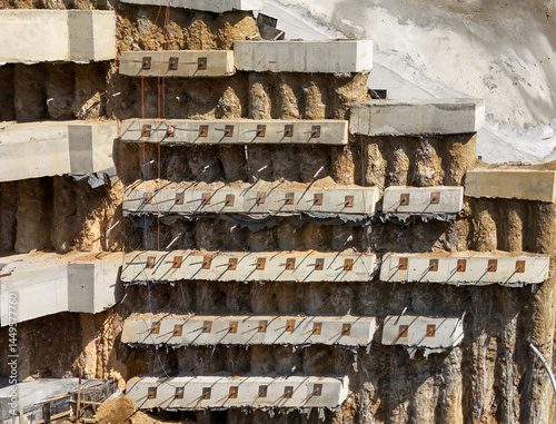 Reinforcing Bars on a Multistory Retaining Wall Construction Site photo