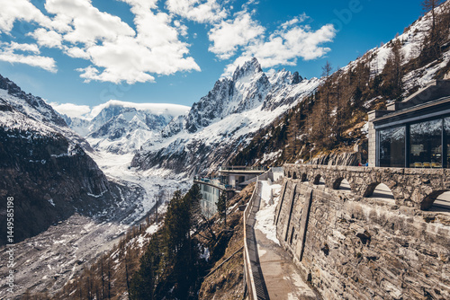 Discover the scenic viewpoint and panoramic views of the Montenvers Mer de Glace and Mont Blanc mountains, and the red train in Chamonix, Haute-Savoie, France.