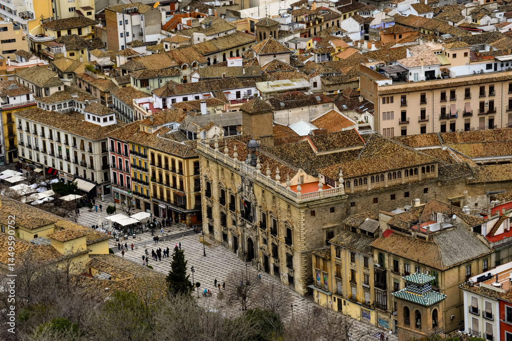 Fototapeta premium A panoramic view of the City of Granada in Spain on a cloudy morning as seen from the Alhambra Palace.