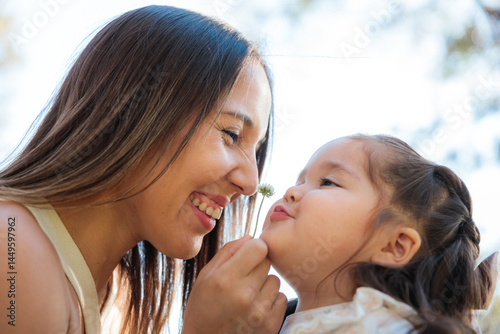 Sweet moment between a young mother and her daughter