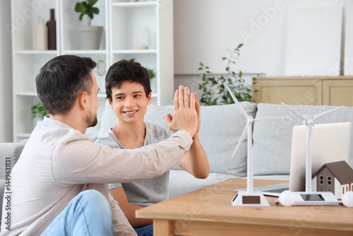 Teenage boy giving his fath...